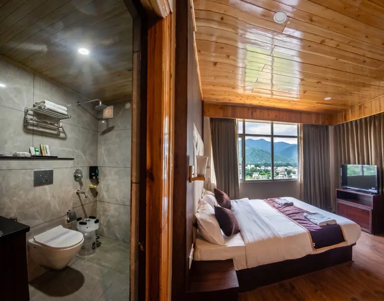Bathroom vanity with mirror, beside the room entrance