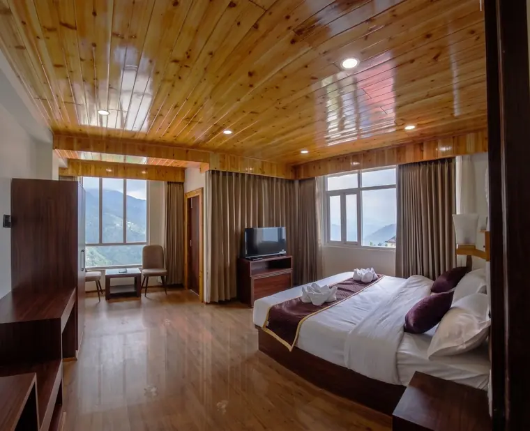Premium Executive room with pine ceiling and a king bed